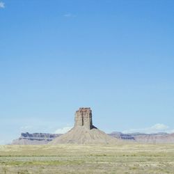 View of landscape against blue sky