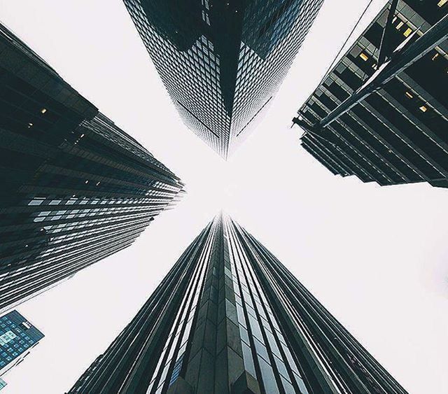 architecture, building exterior, low angle view, skyscraper, built structure, city, tall - high, modern, office building, tower, building, clear sky, tall, directly below, sky, financial district, city life, outdoors, day, sunlight