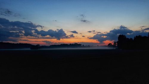 Scenic view of silhouette landscape against sky during sunset