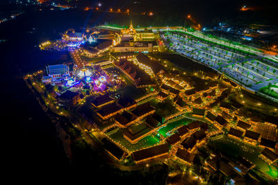 High angle view of illuminated city buildings at night