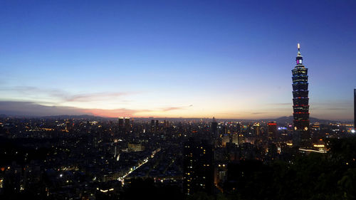 Aerial view of city lit up at night