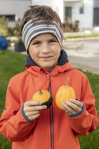 Portrait of boy holding ice cream