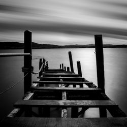 Pier over sea against sky