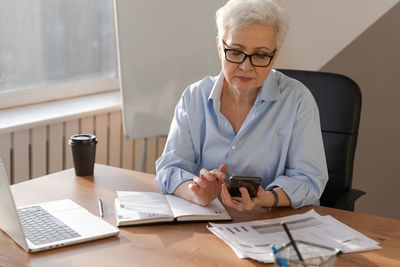 Doctor working at desk in office