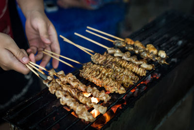 High angle view of preparing food on barbecue grill