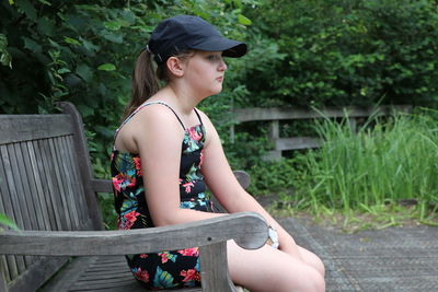 Side view of a young woman looking away