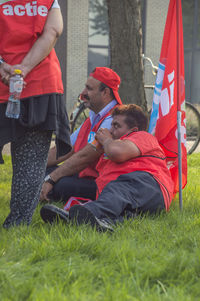 People relaxing on field