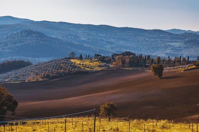 Scenic view of landscape and mountains against sky