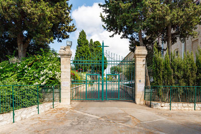 Gate of church against sky