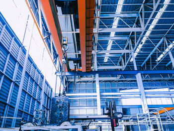 Low angle view of modern building against blue sky