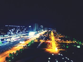 High angle view of illuminated city buildings at night