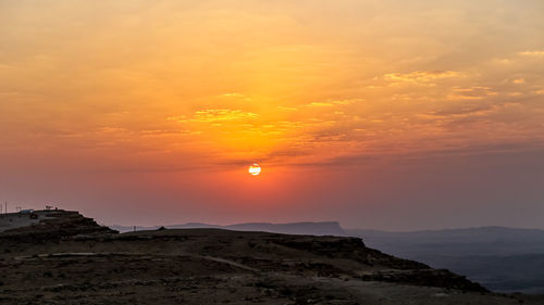 Scenic view of sunset over mountain