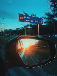 Road sign on side-view mirror