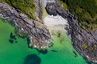 High angle view of rock formation in sea