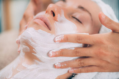 Close-up of woman getting massage therapy at spa