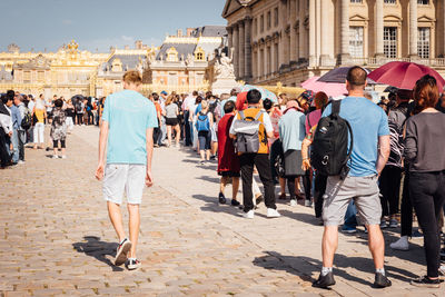 People walking on street in city