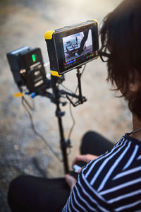 Rear view of woman using mobile phone