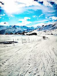 Scenic view of snowcapped mountains against sky