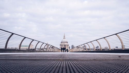 Eiffel tower against cloudy sky