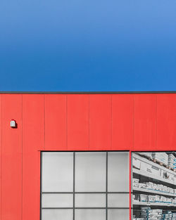 Low angle view of building against blue sky