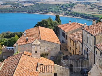 High angle view of townscape by sea