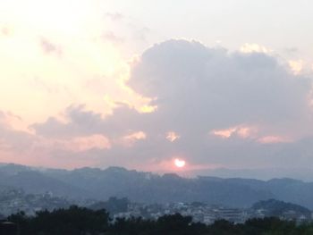 Scenic view of silhouette mountains against sky during sunset