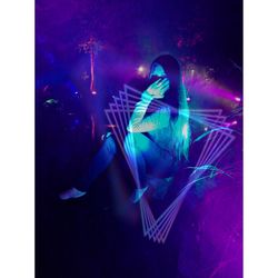 Digital composite image of woman sitting on illuminated stage