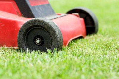 Close-up of vintage car on field