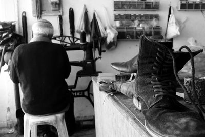 Shoemaker at workshop