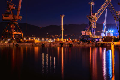 Cranes at harbor at night