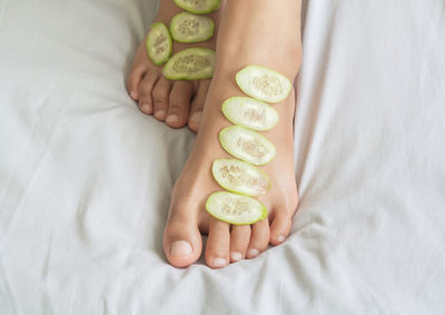 High angle view of woman lying on bed
