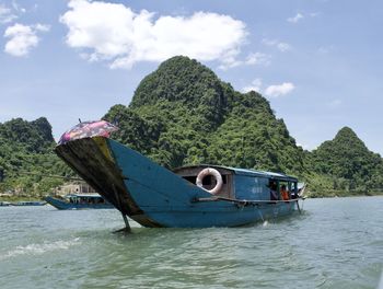Boat in sea against sky