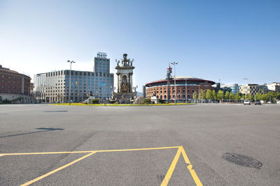 View of city buildings against clear sky