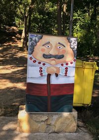 Human face with text on tree