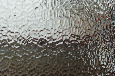 Full frame shot of wet glass window