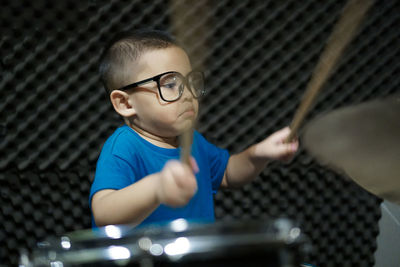 Boy playing drums