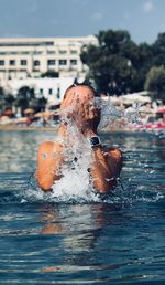 Close-up of man swimming in pool