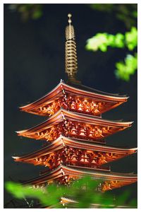 Low angle view of illuminated traditional building at night