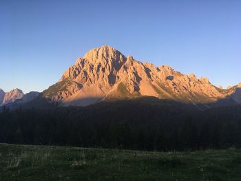 Scenic view of mountain range against clear blue sky