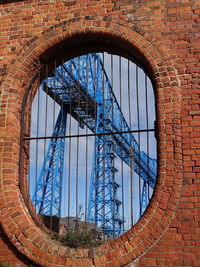 Low angle view of bridge seen through window