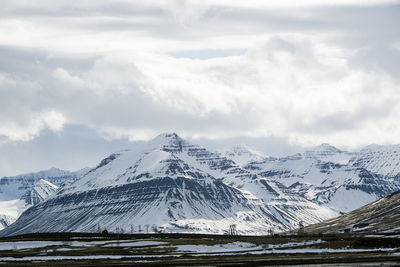 Snow-covered volcanic mountain landscape in iceland