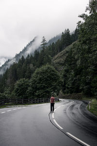 Rear view of man on mountain road