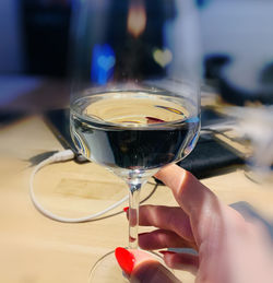 Close-up of hand holding wine glass