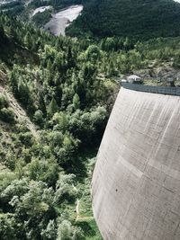 High angle view of dam amidst trees in forest