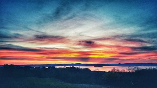 Scenic view of dramatic sky during sunset