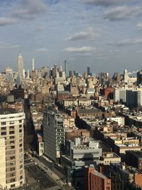 High angle view of buildings in city against sky