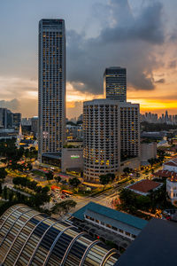 High angle view of buildings in city against sky during sunset
