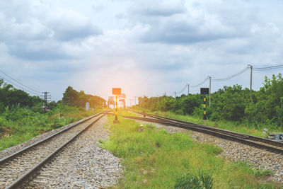 View of railway tracks against cloudy sky