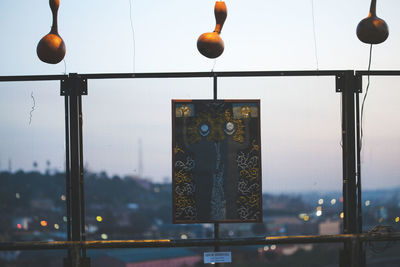 Close-up of illuminated street light against sky