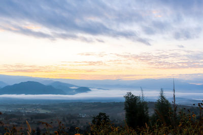 Scenic view of mountains against sky during sunset